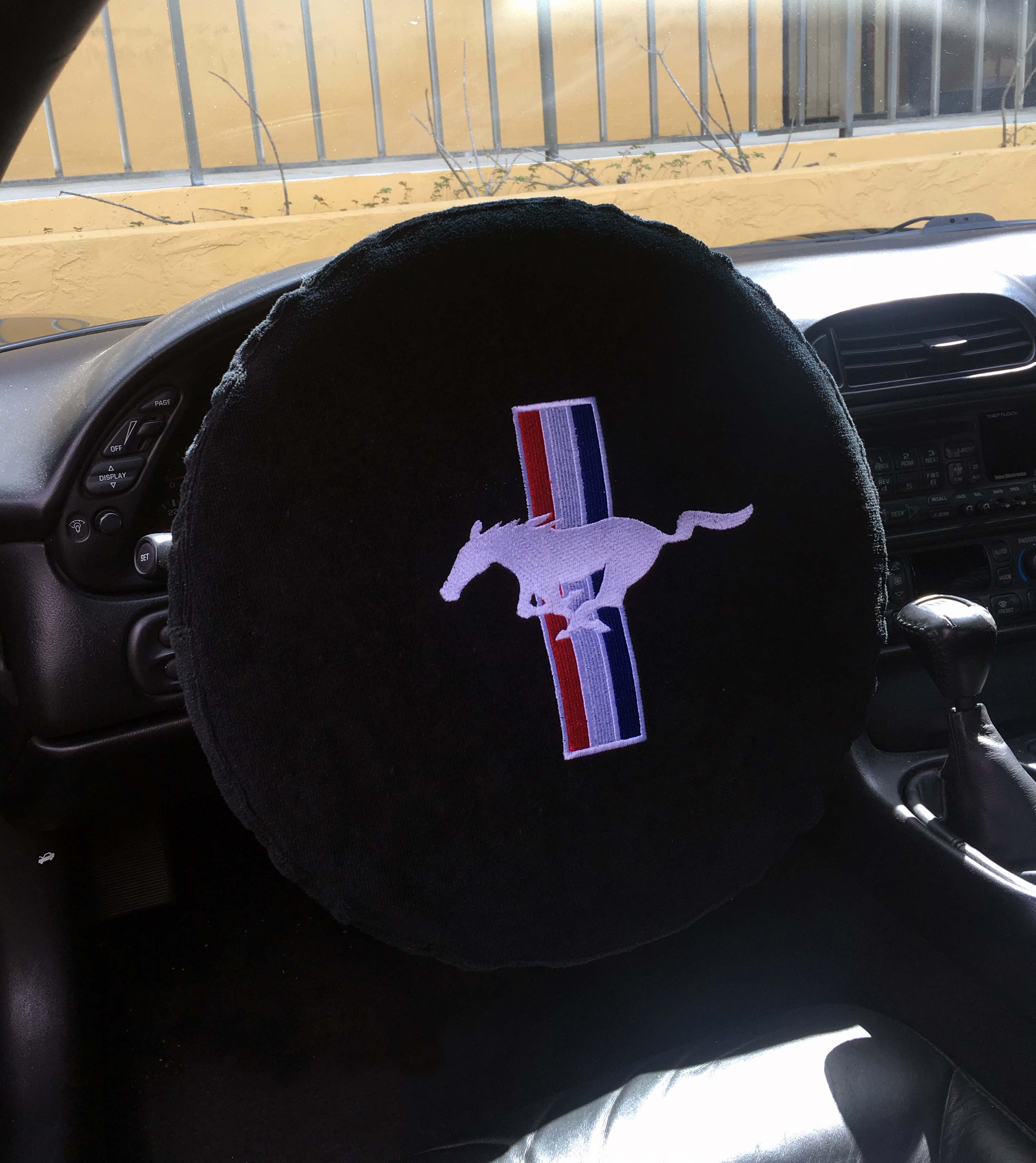 Seat Armour ® - Black Universal Steering Wheel Protector with Mustang Embroidery (SWA100MUSB) - Main Image